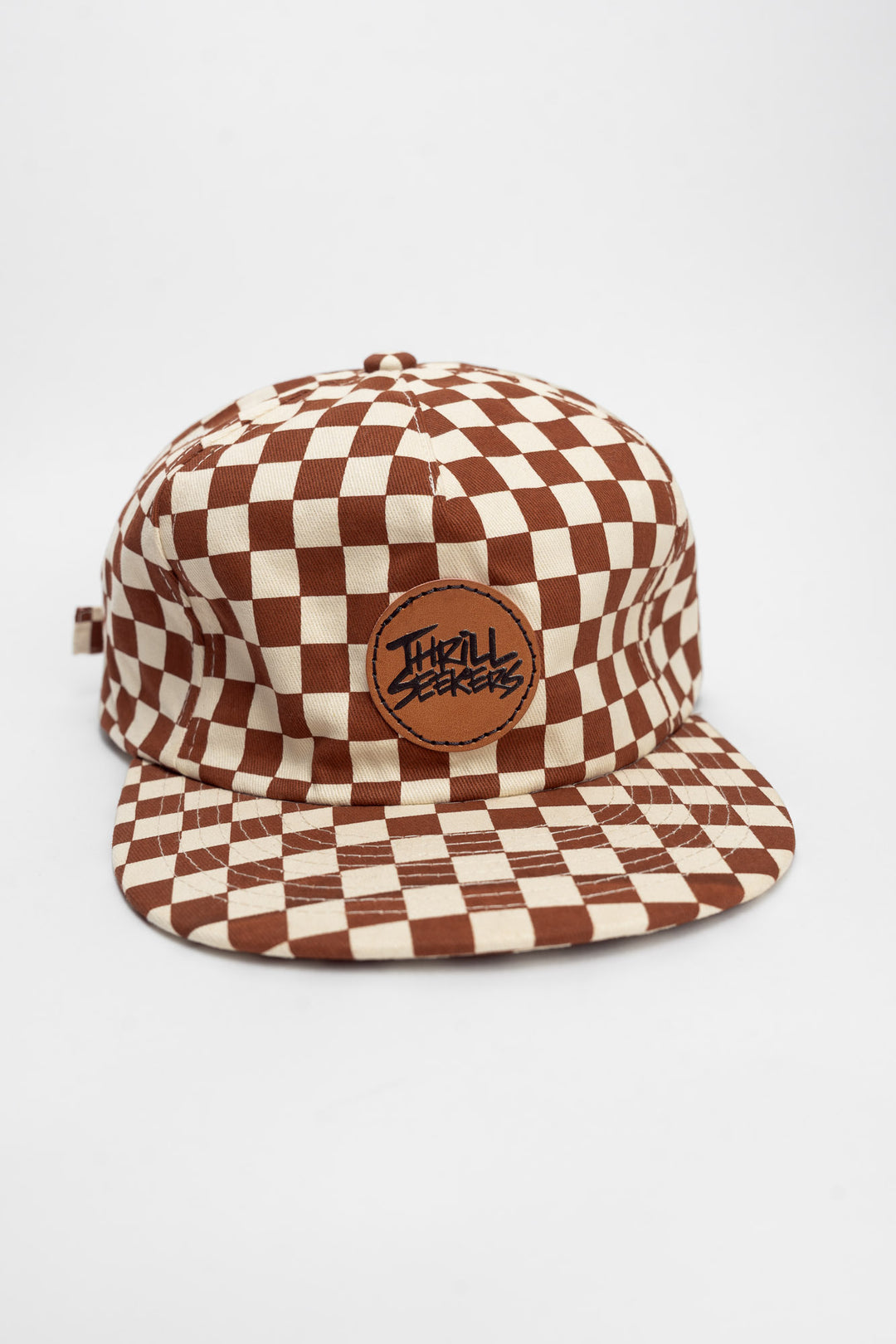 Checkered cap with rusty clay and off-white on a white background