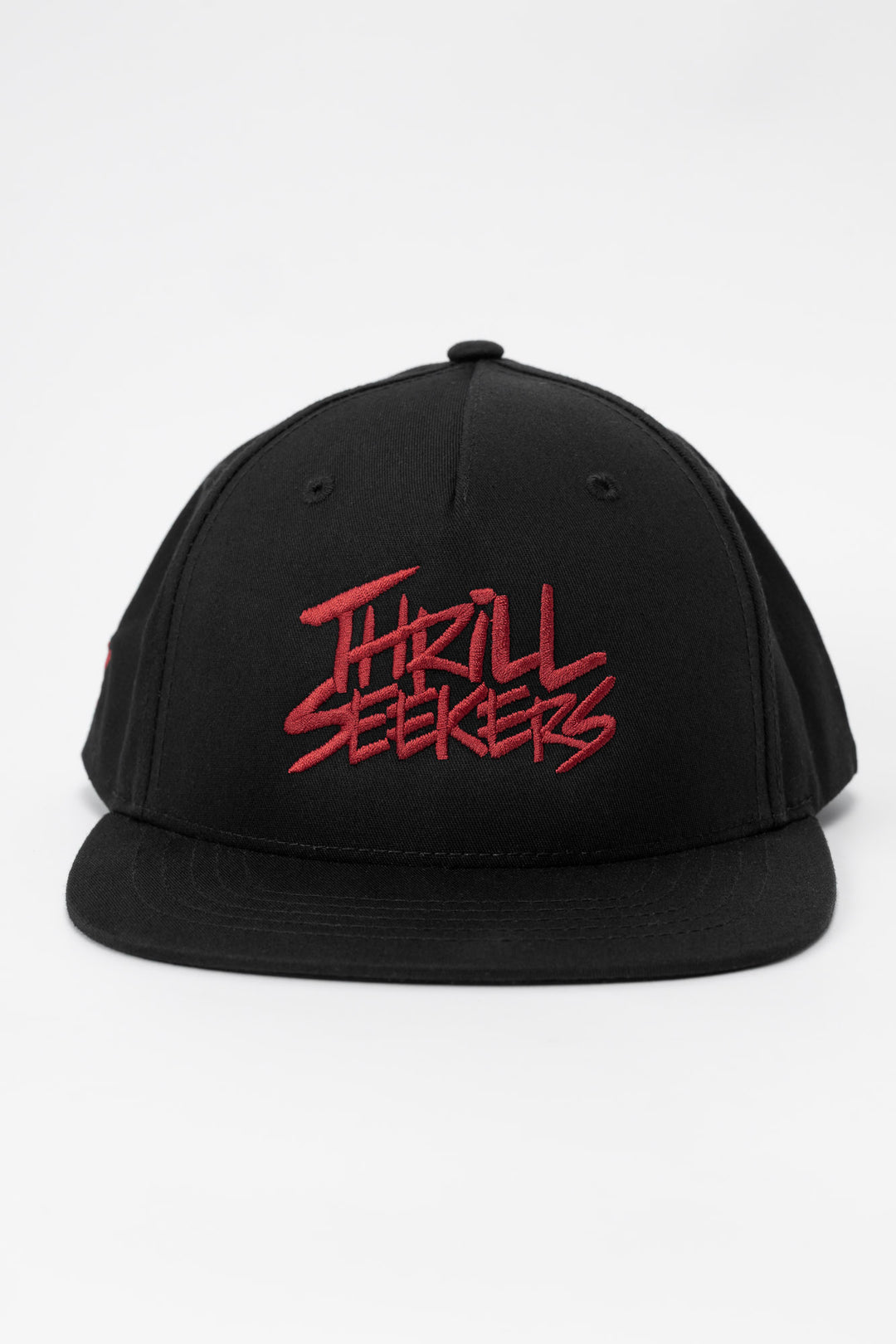 Black cap with cardinal red 'Thrill Seekers' text on a white background