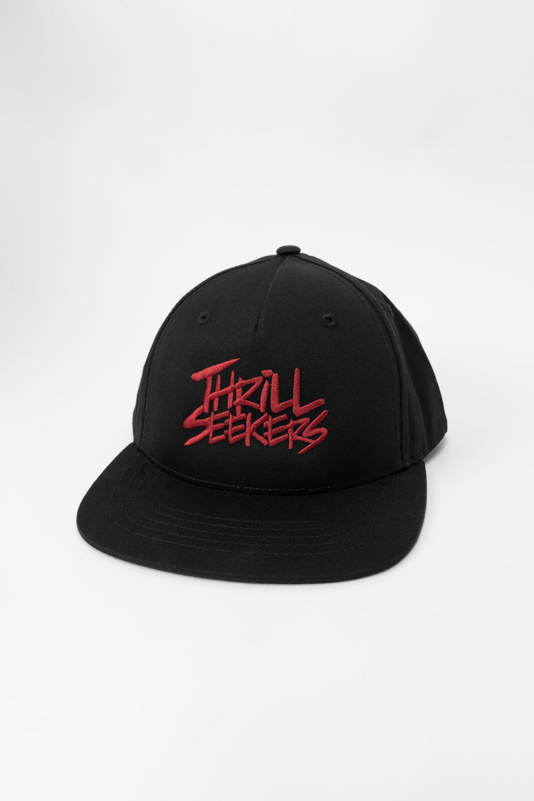 Black cap with cardinal red 'Thrill Seekers' text on a white background
