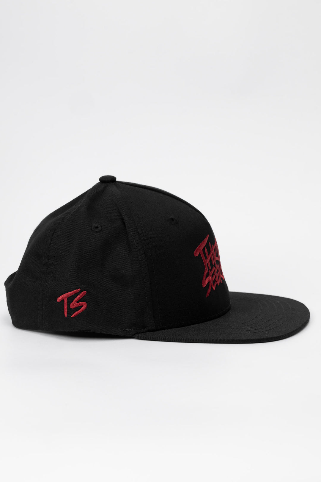 Side profile of hat featuring a 'ts' logo in cardinal red