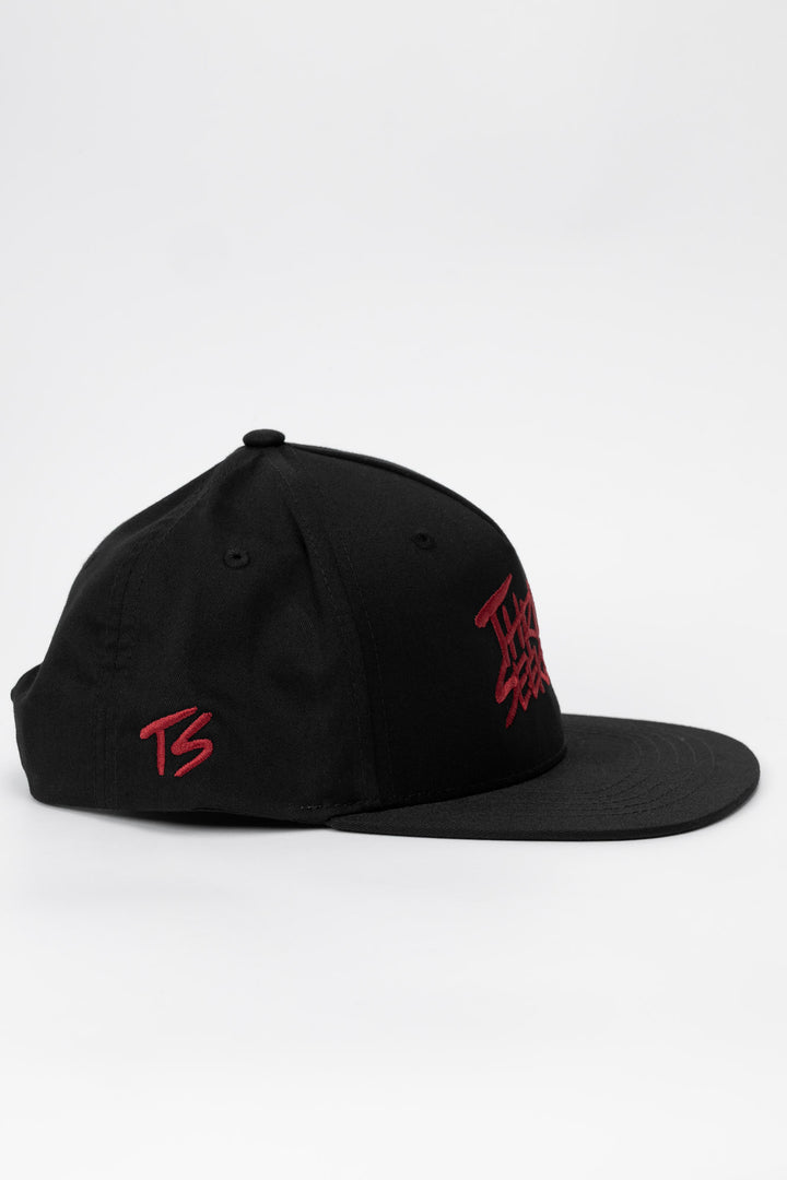 Side profile of hat featuring a 'ts' logo in cardinal red