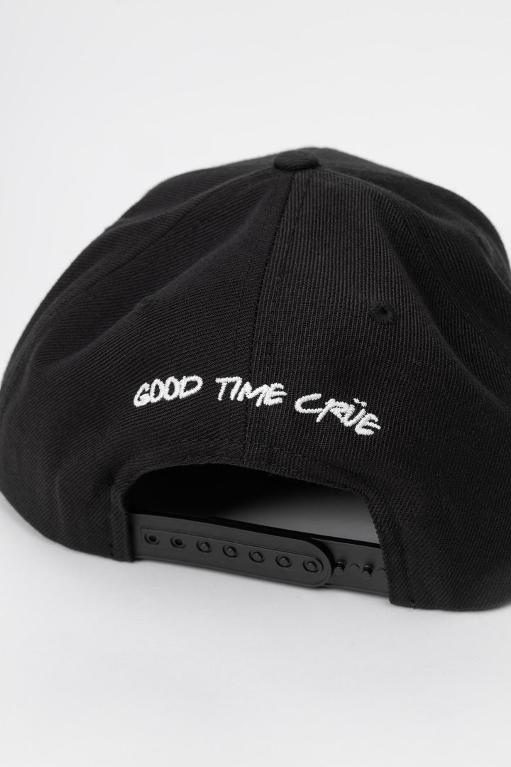 Kids black cap with 'Thrill Seekers' white logo on a white background