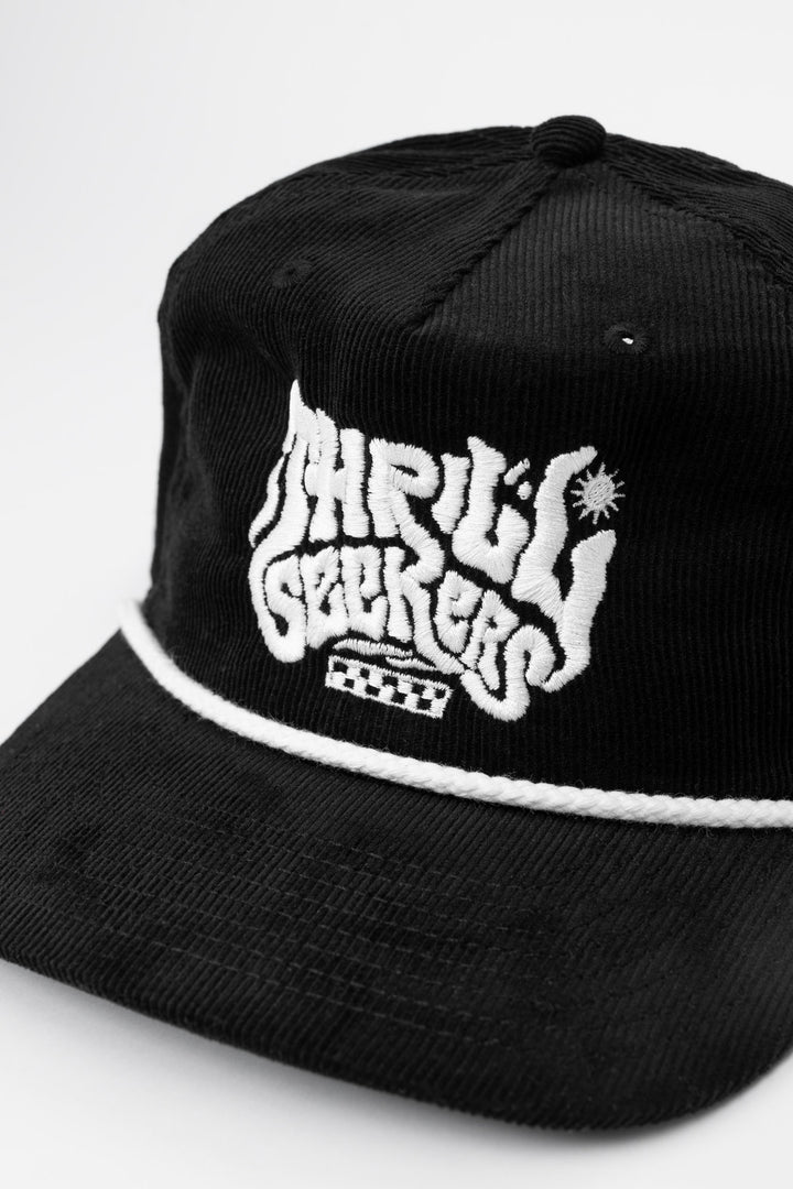 Black cap corduroy with 'Thrill Seekers' smokin' white logo on a white background