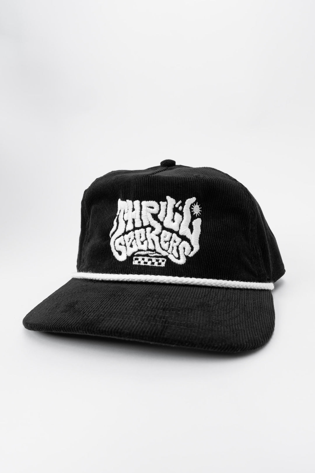 Black cap corduroy with 'Thrill Seekers' smokin' white logo on a white background