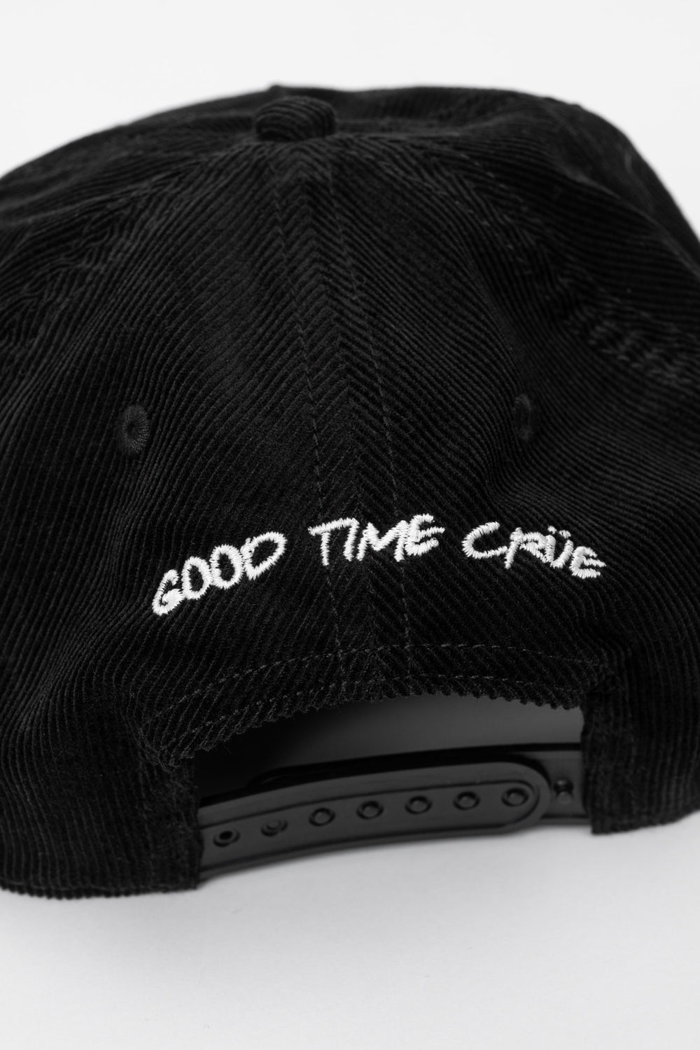 Back of a black cap corduroy with 'Good Time Crue' on a white background