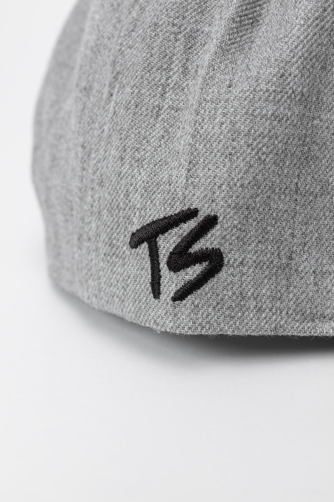 Grey snapback hat with 'Thrill Seekers' logo in black