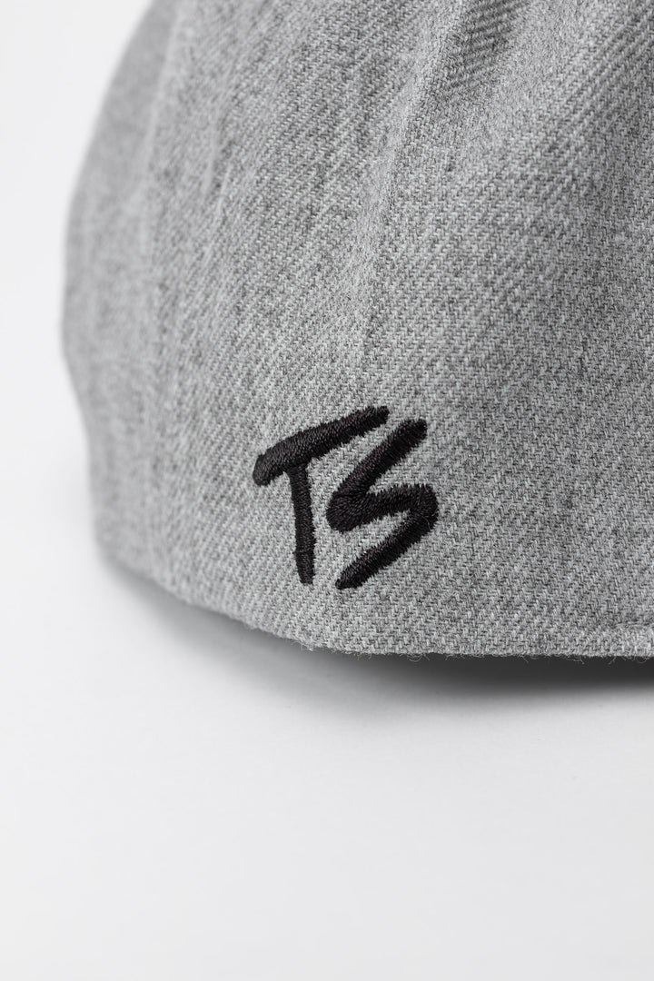 Grey snapback hat with 'Thrill Seekers' logo in black