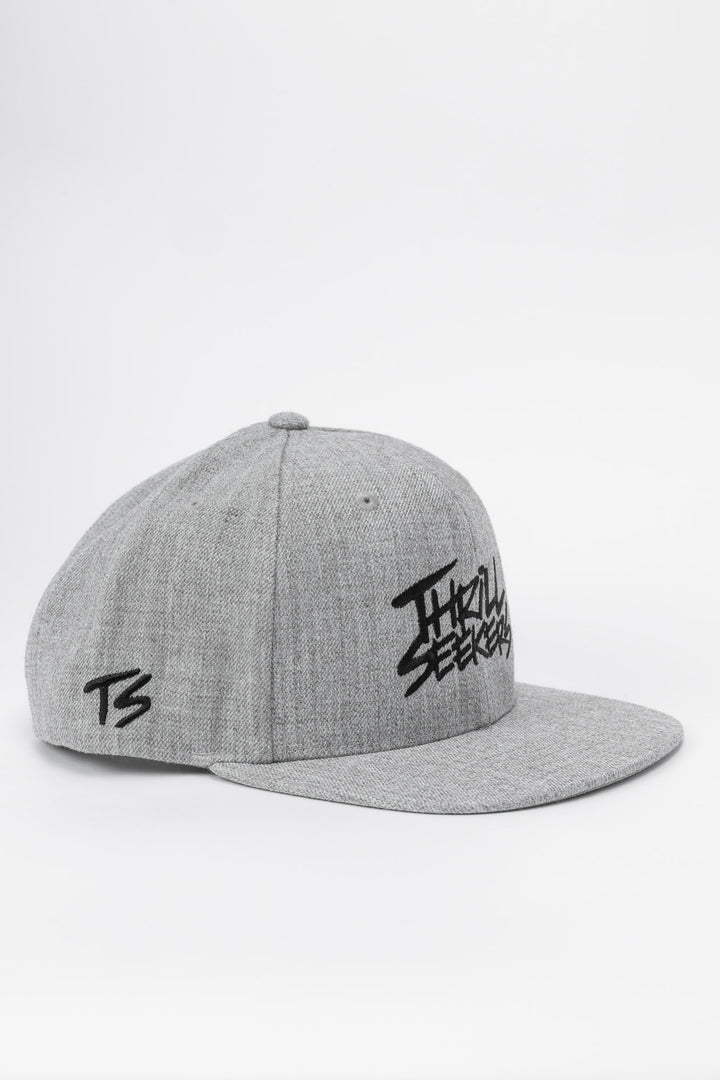 Grey cap with black 'Thrill Seekers' logo on a white background