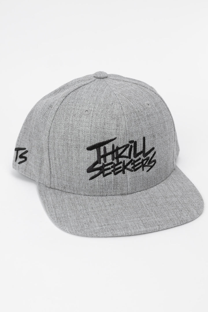 Grey cap with black 'Thrill Seekers' logo on a white background
