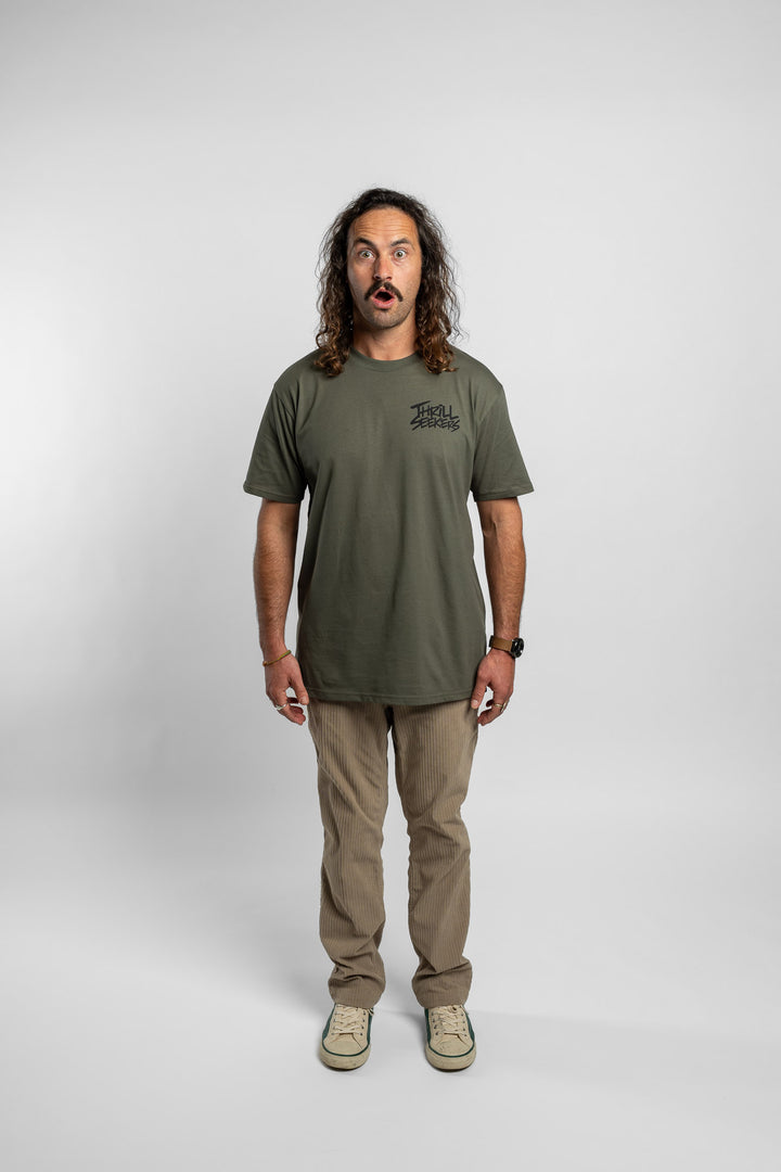 Person wearing a cypress tee with 'Thrill Seekers' logo in black