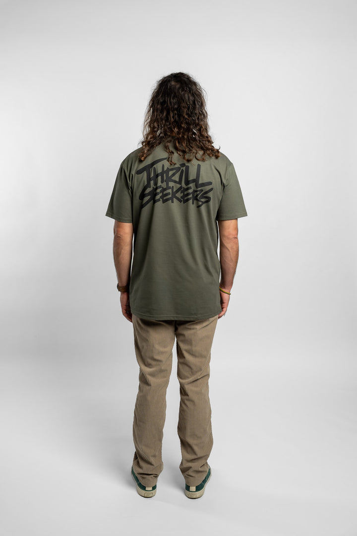 Person wearing a cypress tee with 'Thrill Seekers' logo in black