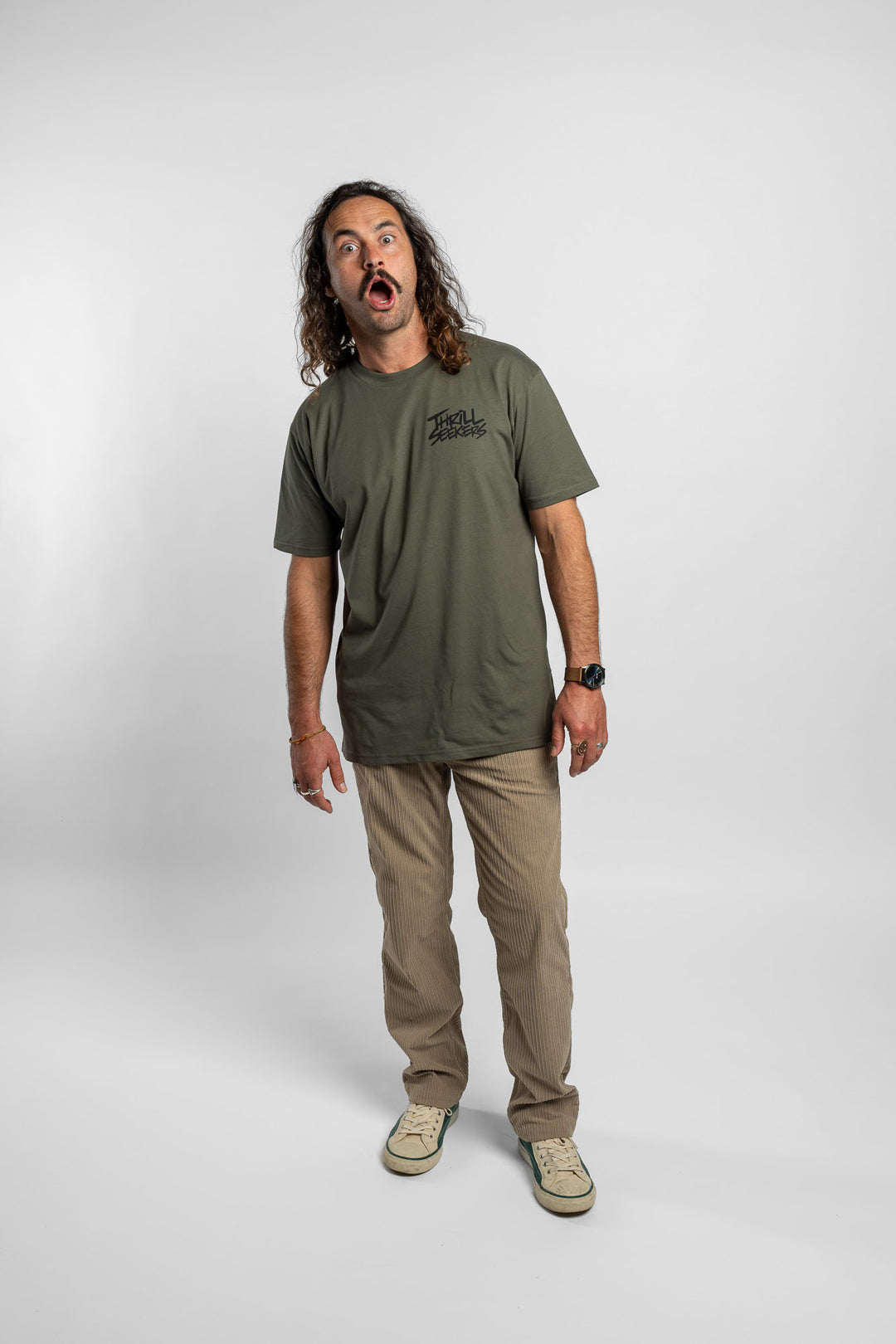 Person wearing a cypress tee with 'Thrill Seekers' logo in black