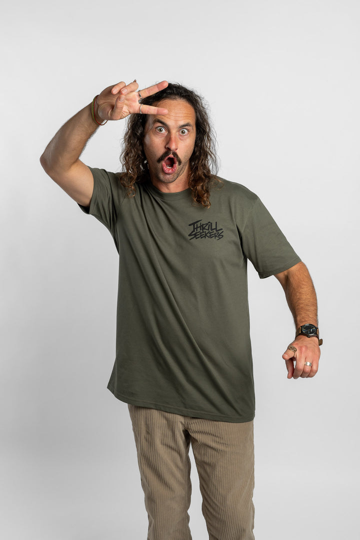 Person wearing a cypress tee with 'Thrill Seekers' logo in black