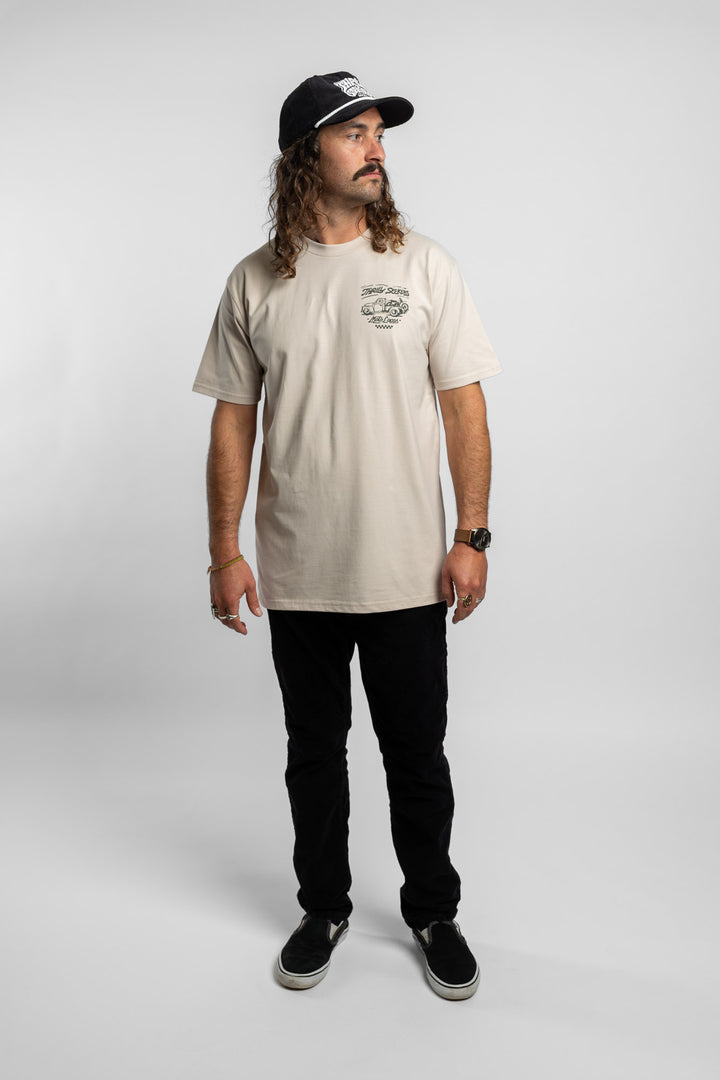 Person wearing bone tee with 'Thrill Seekers' moto locos logo in green