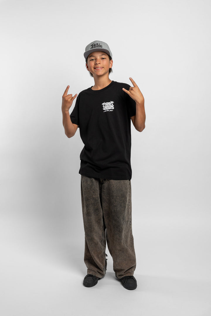 Kid wearing black tee with 'Thrill Seekers' good time supply logo in white