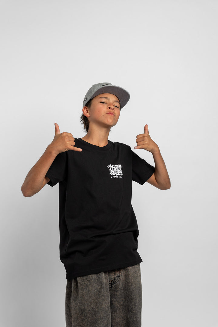 Kid wearing black tee with 'Thrill Seekers' good time supply logo in white