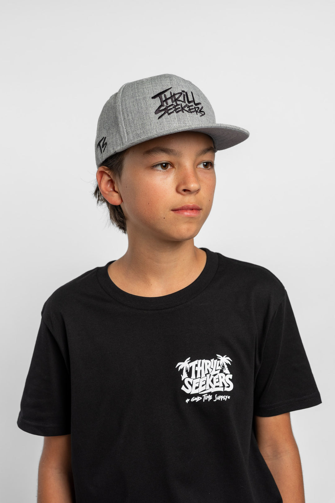 Grey cap with black 'Thrill Seekers' logo on a white background
