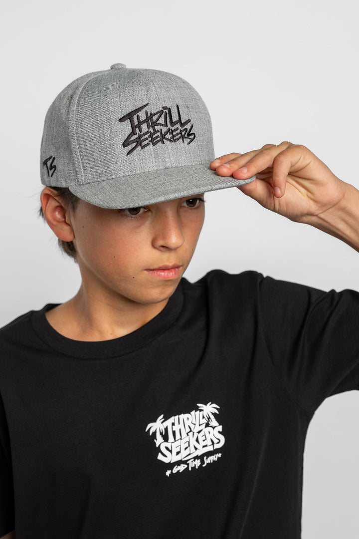 Grey cap with black 'Thrill Seekers' logo on a white background