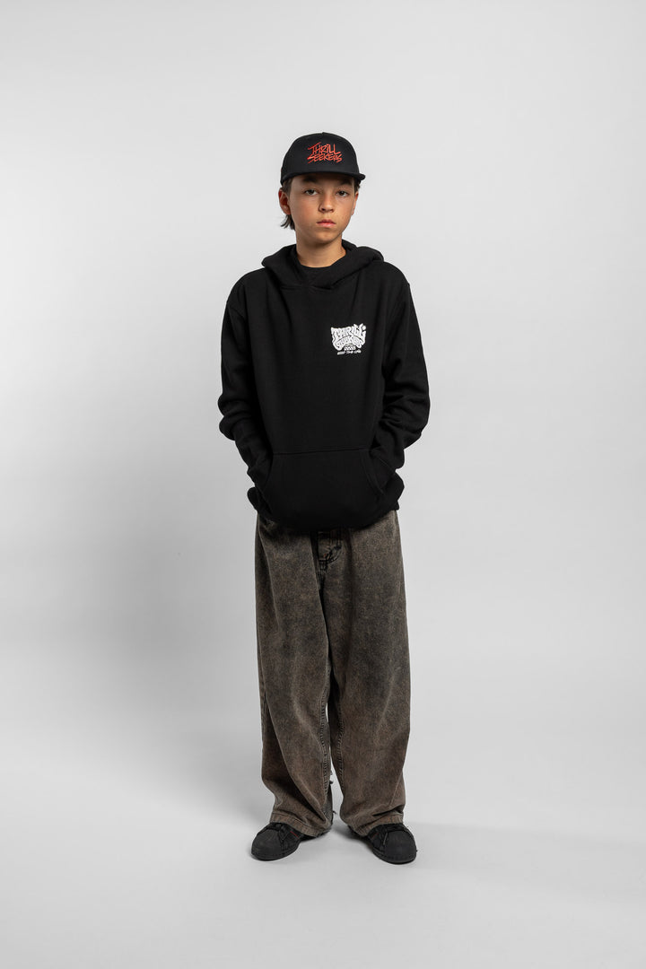 Kid wearing black hoodie with 'Thrill Seekers' smokin' logo in black
