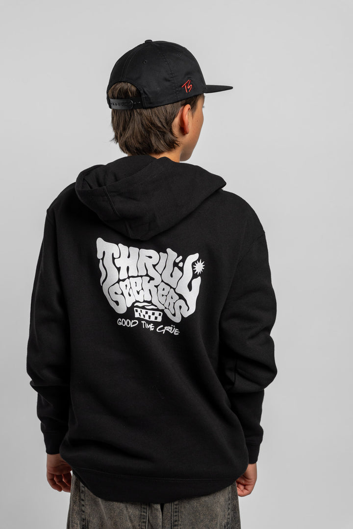 Kid wearing black hoodie with 'Thrill Seekers' smokin' logo in black