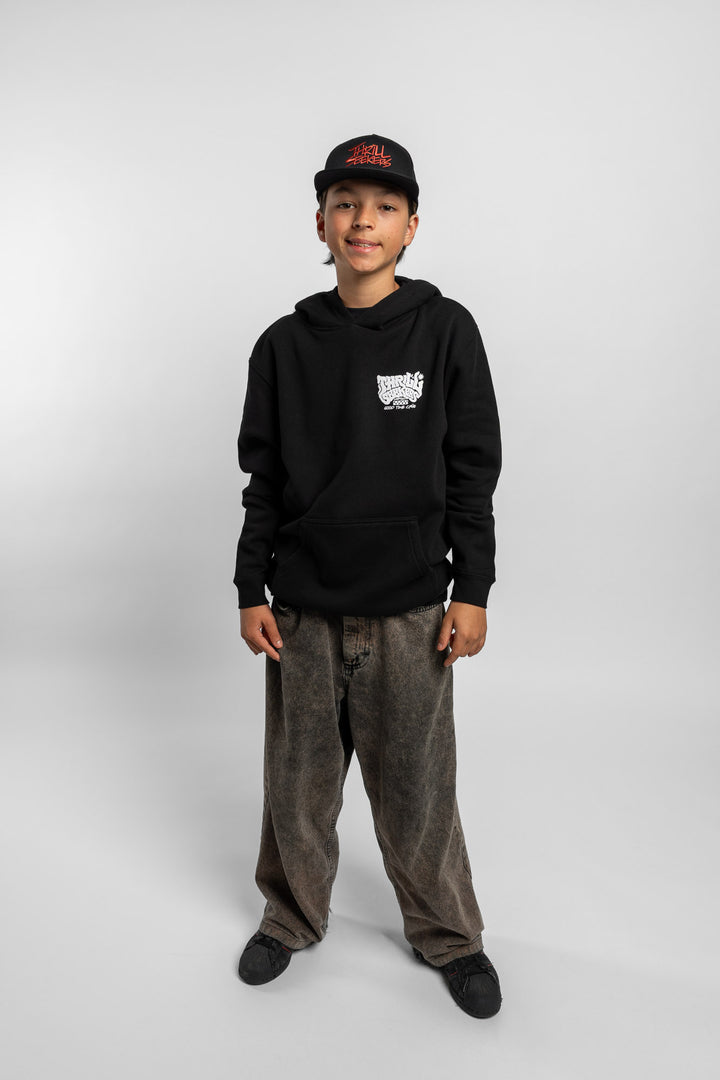 Kid wearing black hoodie with 'Thrill Seekers' smokin' logo in black