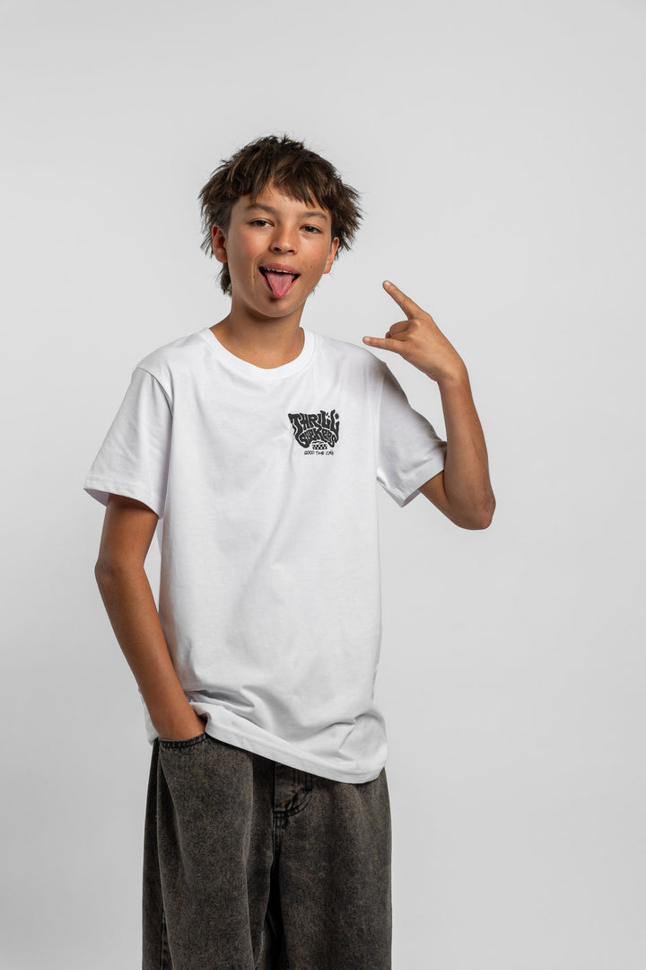 Kid wearing a white tee with 'Thrill Seekers' smokin logo in black