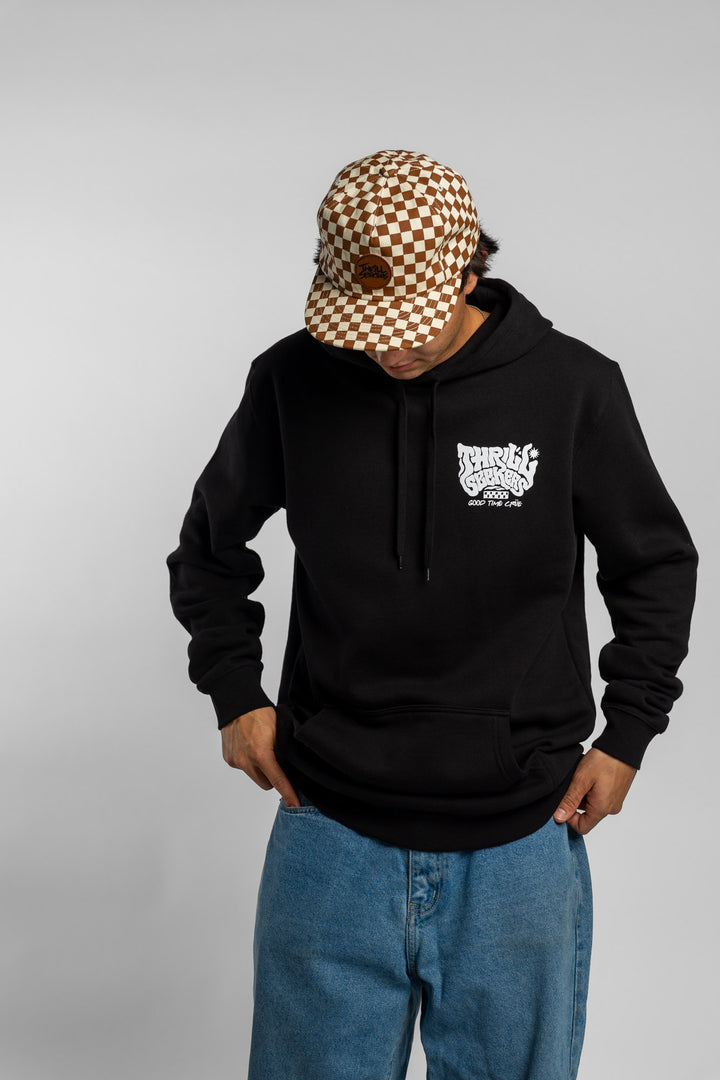 Person wearing a black hoodie with a 'Thrill Seekers' smokin' logo in white