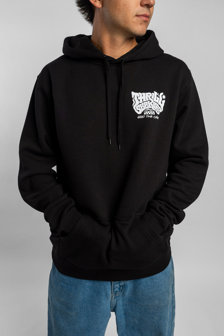 Person wearing a black hoodie with a 'Thrill Seekers' smokin' logo in white